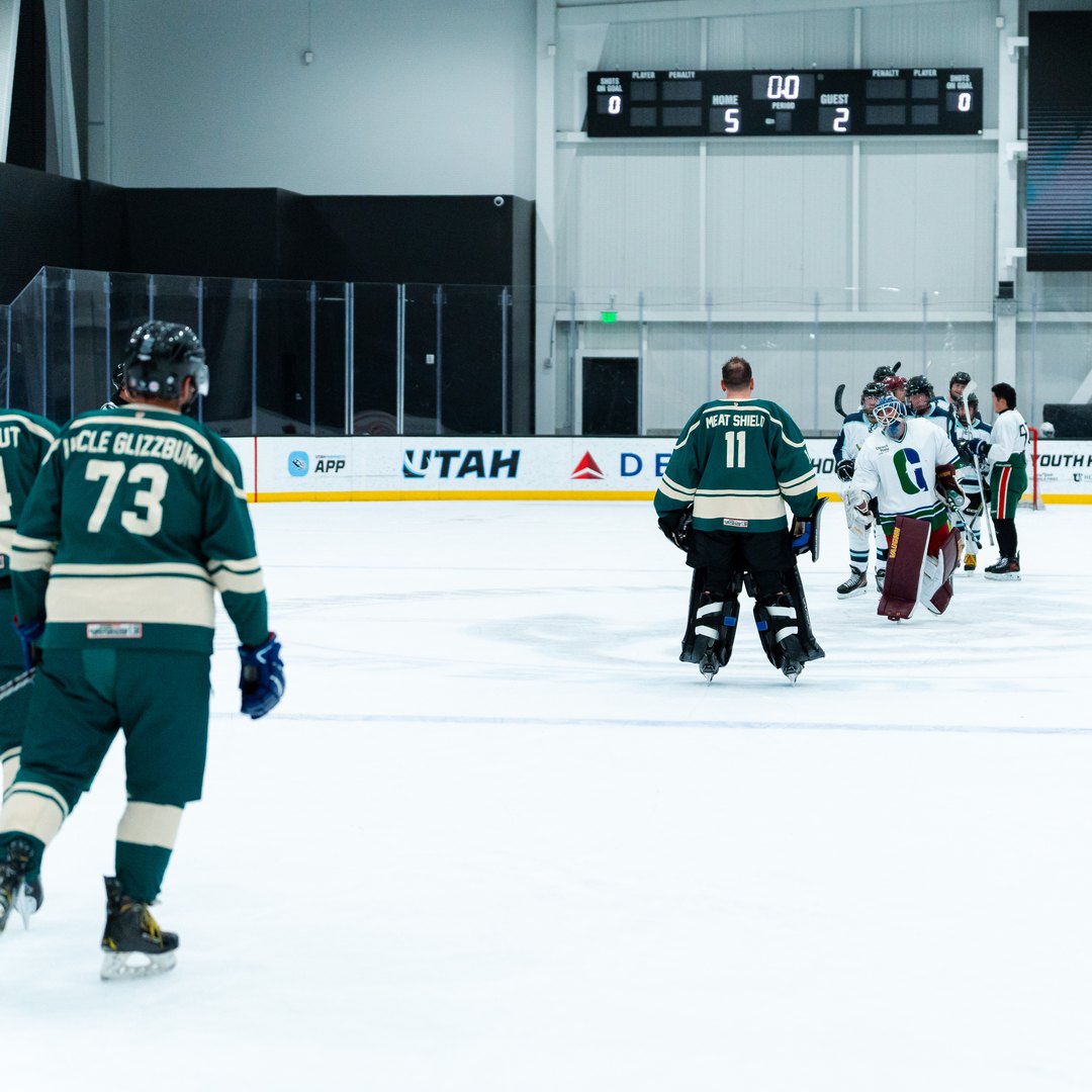 Beer league hockey players shaking hands in the handshake line after a game
