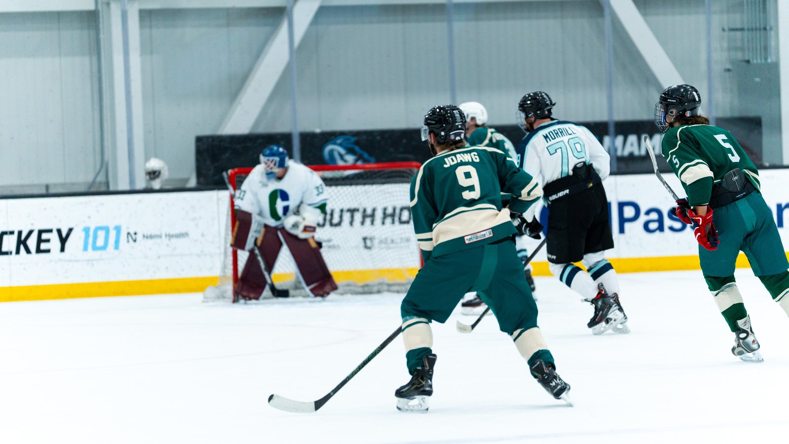 Adult hockey player skating hard on Utah ice